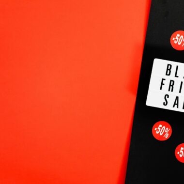 Black Friday sale advertisement with bold red background and discount signs.