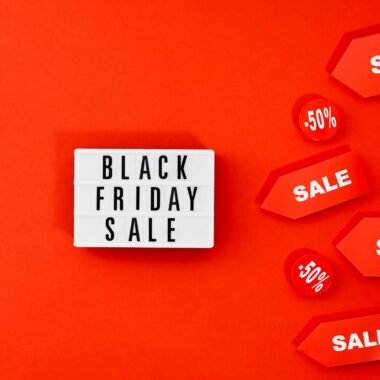 Eye-catching Black Friday sale display with discounts on a bold red background.